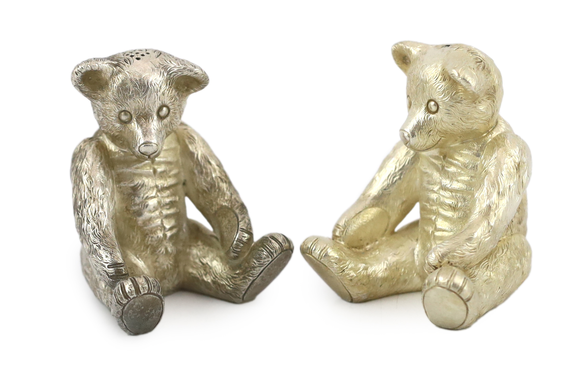 A pair of Elizabeth II cast silver novelty condiments, each modelled as a seated teddy bear